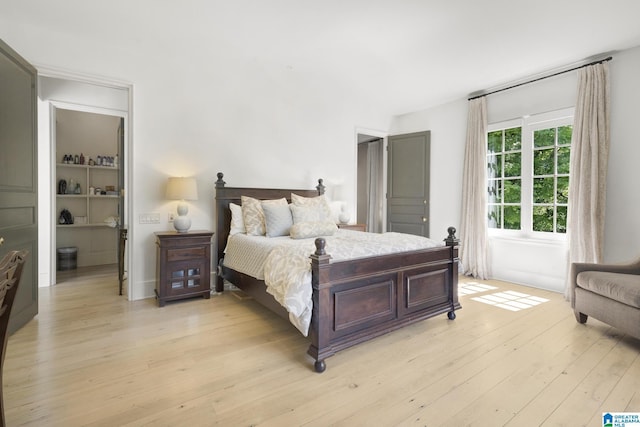 bedroom with light wood-type flooring
