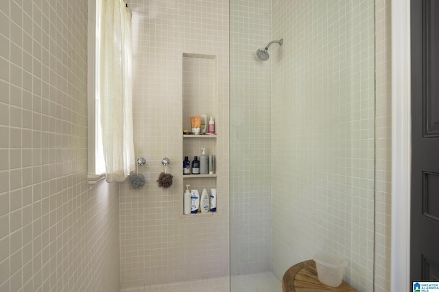 bathroom with tiled shower
