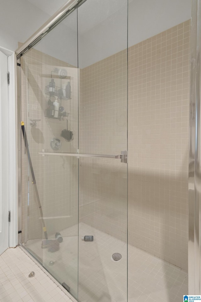 bathroom featuring a shower stall and tile patterned floors