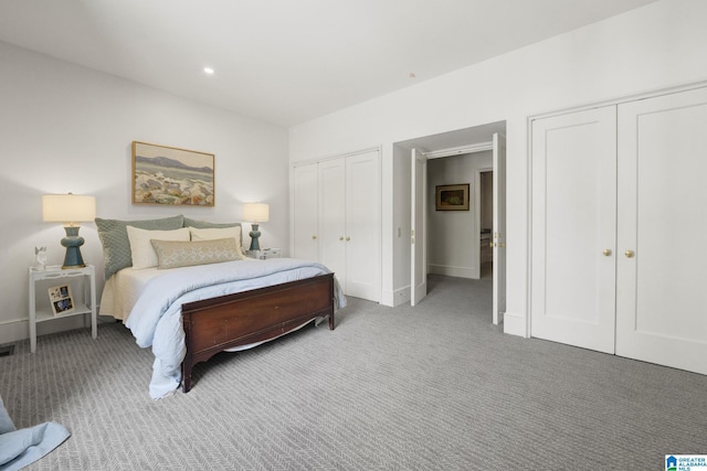 bedroom with multiple closets, carpet, baseboards, and recessed lighting
