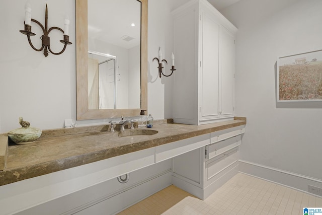 bathroom featuring vanity and tile patterned flooring