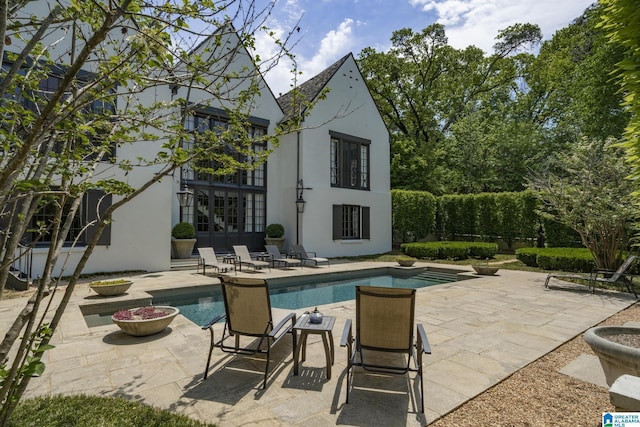 outdoor pool with a patio