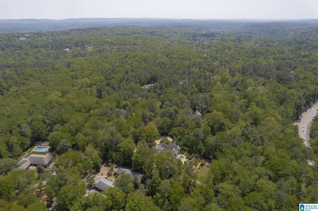 aerial overview of property's location featuring a forest