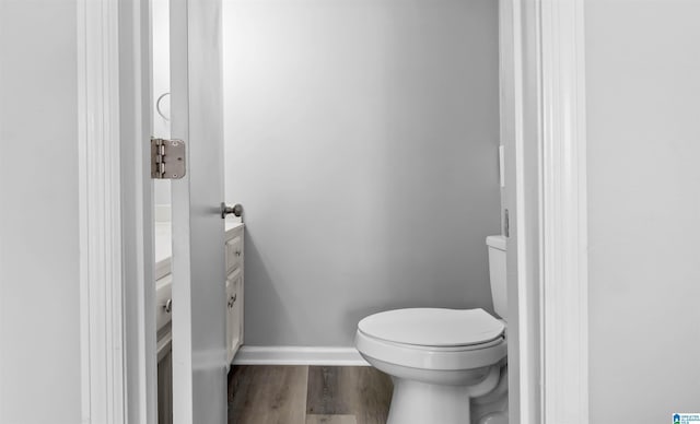 3657 Haven View Cir Unit 3657, Hoover, AL 35216 - bathroom with wood finished floors, toilet, vanity, and baseboards