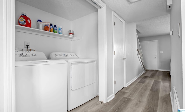 3657 Haven View Cir Unit 3657, Hoover, AL 35216 - washroom with a textured ceiling, washing machine and dryer, light wood-style floors, baseboard heating, and baseboards
