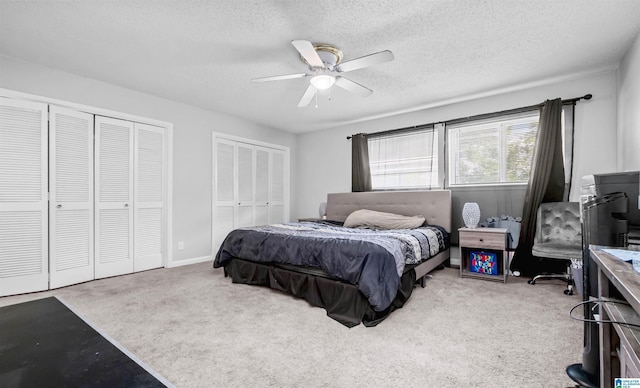 3657 Haven View Cir Unit 3657, Hoover, AL 35216 - bedroom with multiple closets, carpet flooring, a textured ceiling, and a ceiling fan