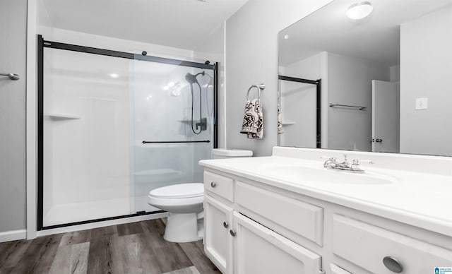 3657 Haven View Cir Unit 3657, Hoover, AL 35216 - bathroom with a stall shower, wood finished floors, toilet, and vanity