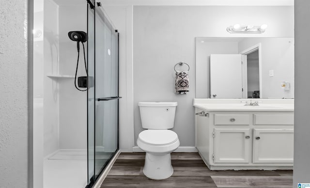 3657 Haven View Cir Unit 3657, Hoover, AL 35216 - bathroom featuring a shower stall, toilet, wood finished floors, and vanity