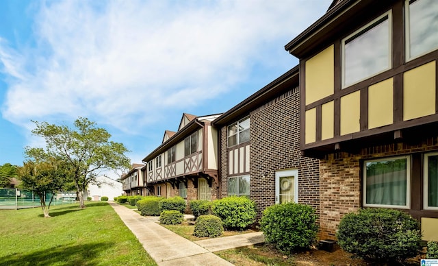 3657 Haven View Cir Unit 3657, Hoover, AL 35216 - view of property exterior featuring brick siding and a lawn