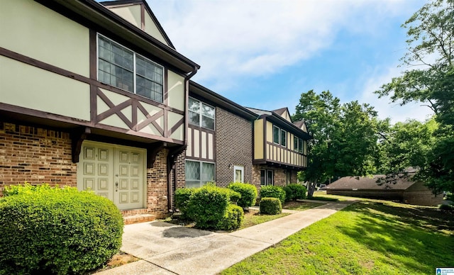 3657 Haven View Cir Unit 3657, Hoover, AL 35216 - view of side of home with brick siding, stucco siding, and a lawn