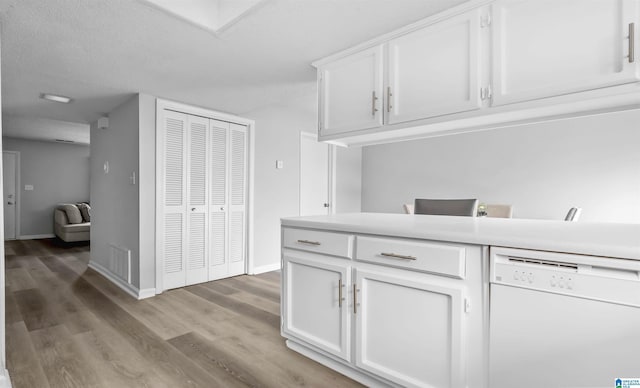 3657 Haven View Cir Unit 3657, Hoover, AL 35216 - kitchen featuring dishwasher, white cabinetry, light wood-style floors, and light countertops