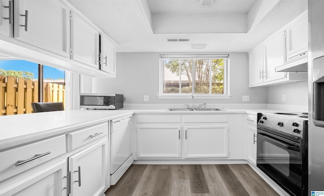 3657 Haven View Cir Unit 3657, Hoover, AL 35216 - kitchen with electric range, stainless steel microwave, dishwasher, a sink, and wood finished floors
