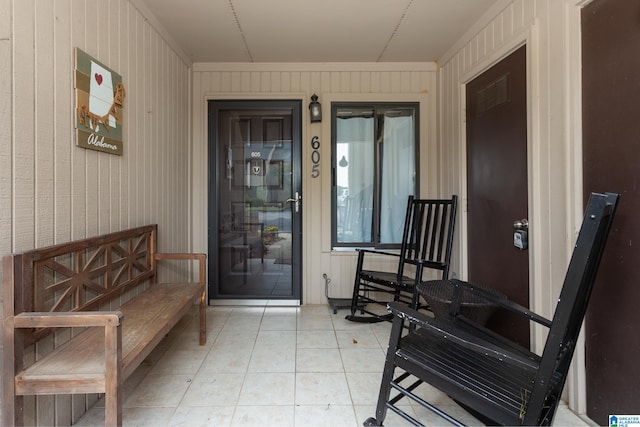 view of exterior entry with covered porch
