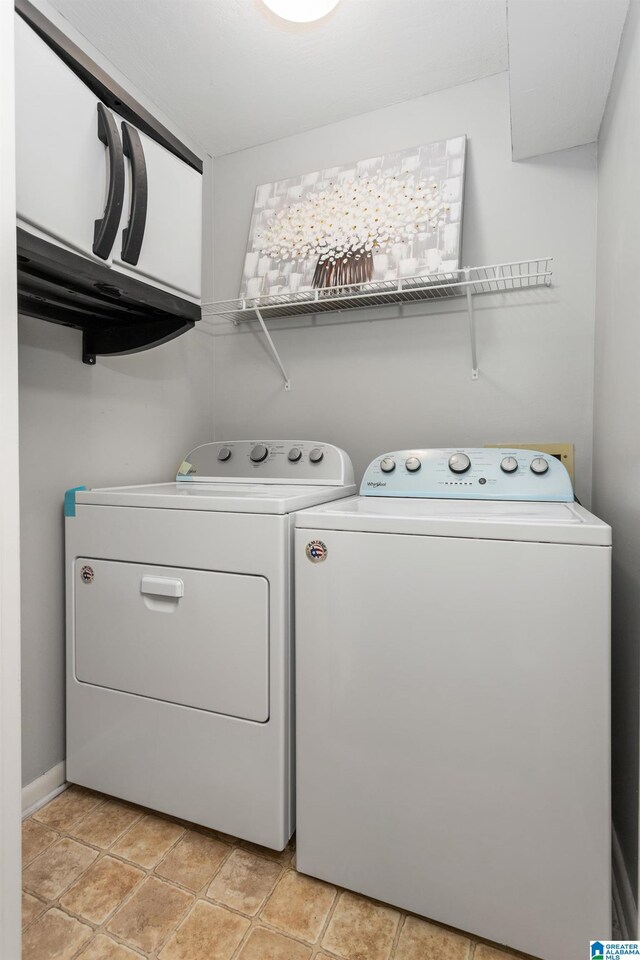 laundry area with independent washer and dryer