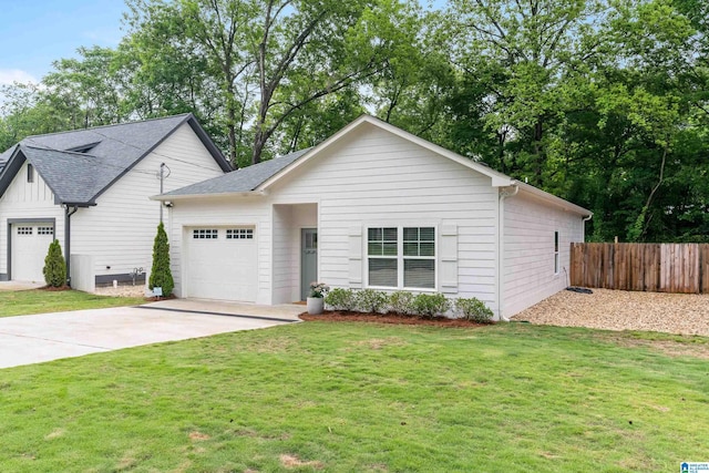 2213 3rd Ave S, Irondale, AL 35210 - view of front facade with a garage, concrete driveway, and roof with shingles