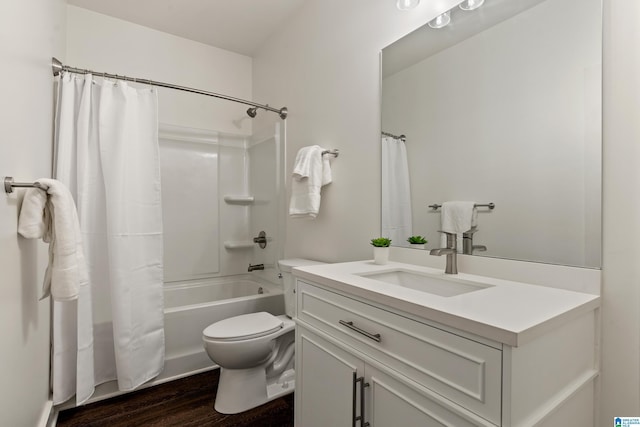 2213 3rd Ave S, Irondale, AL 35210 - bathroom with wood finished floors, toilet, vanity, and shower / tub combo