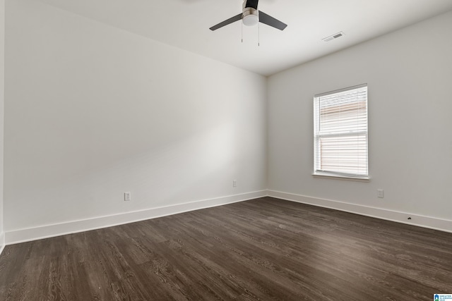 2213 3rd Ave S, Irondale, AL 35210 - unfurnished room featuring dark wood-style flooring, baseboards, and ceiling fan