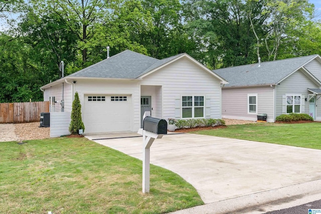 2213 3rd Ave S, Irondale, AL 35210 - ranch-style home featuring concrete driveway, an attached garage, roof with shingles, and central air condition unit
