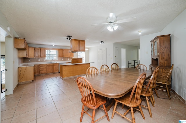 1492 Paul Allman Rd, Adger, AL 35006 - dining space with a ceiling fan, light tile patterned floors, a textured ceiling, and baseboards