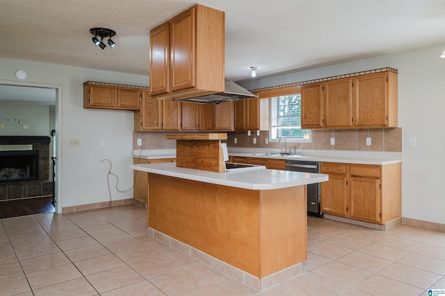 1492 Paul Allman Rd, Adger, AL 35006 - kitchen featuring stainless steel dishwasher, a sink, light countertops, brown cabinetry, and backsplash