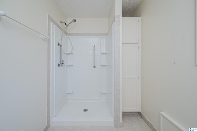 1492 Paul Allman Rd, Adger, AL 35006 - bathroom with a shower stall, a textured ceiling, and tile patterned flooring