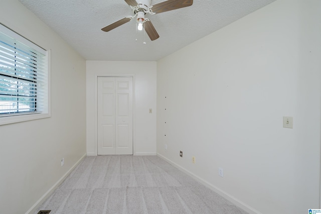 1492 Paul Allman Rd, Adger, AL 35006 - spare room with light carpet, a textured ceiling, ceiling fan, and baseboards