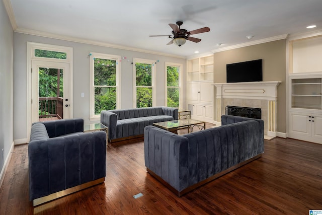 5308 Hickory Trce, Hoover, AL 35244 - living area featuring a tile fireplace, wood finished floors, built in features, a ceiling fan, and crown molding
