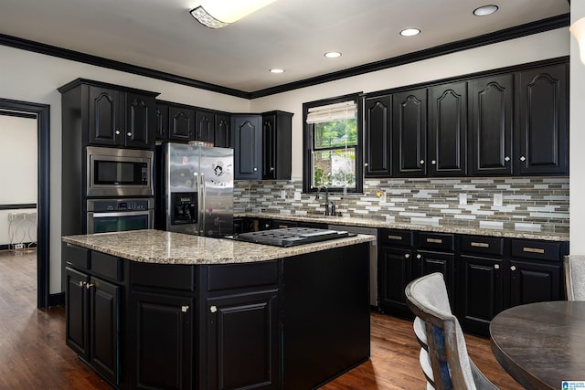 5308 Hickory Trce, Hoover, AL 35244 - kitchen featuring dark cabinetry, appliances with stainless steel finishes, crown molding, backsplash, and recessed lighting