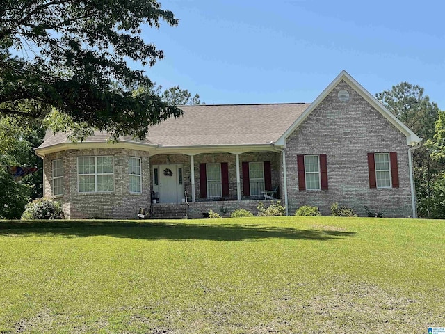 154 Baron Dr, Chelsea, AL 35043 - ranch-style house featuring a porch, a front yard, brick siding, and roof with shingles