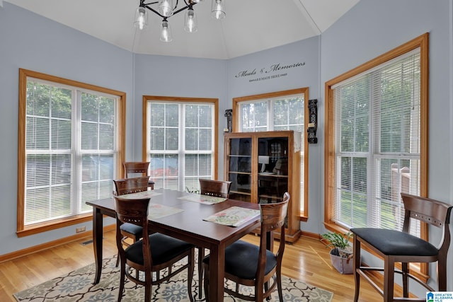 154 Baron Dr, Chelsea, AL 35043 - dining space featuring a chandelier, light wood-style floors, baseboards, and lofted ceiling