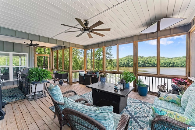 7 Stillwaters Trl, Sylacauga, AL 35151 - sunroom with ceiling fan, an outdoor living space, and a water view