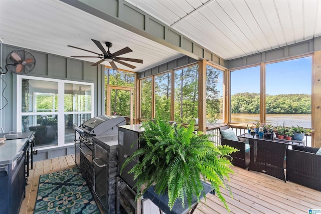 7 Stillwaters Trl, Sylacauga, AL 35151 - sunroom / solarium featuring a ceiling fan, an outdoor kitchen, and a water view