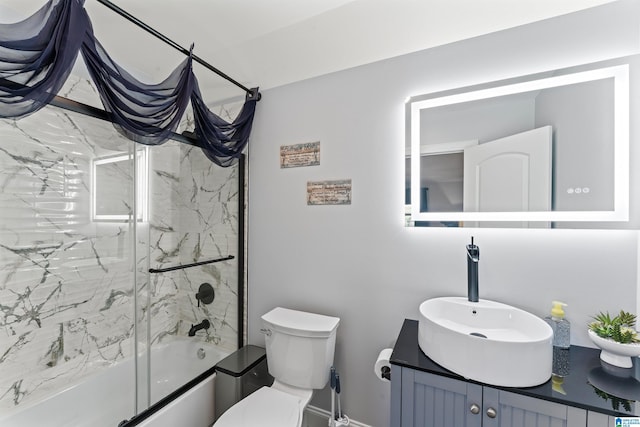 7 Stillwaters Trl, Sylacauga, AL 35151 - bathroom featuring vanity, combined bath / shower with glass door, toilet, and baseboards