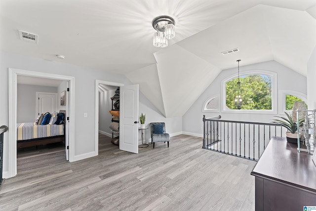7 Stillwaters Trl, Sylacauga, AL 35151 - bonus room featuring light wood-style flooring, a chandelier, lofted ceiling, and baseboards