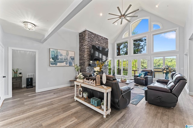 7 Stillwaters Trl, Sylacauga, AL 35151 - living area featuring high vaulted ceiling, ceiling fan, light wood-style flooring, and baseboards