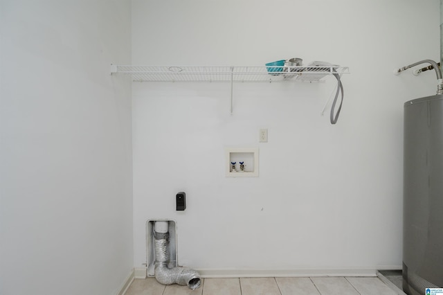 washroom with water heater, baseboards, hookup for an electric dryer, light tile patterned flooring, and hookup for a washing machine