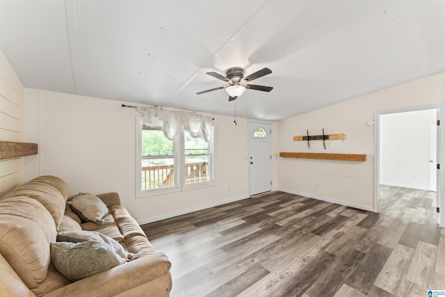 110 Cleburne St, Attalla, AL 35954 - living room with dark wood-type flooring, ceiling fan, lofted ceiling, and baseboards