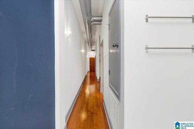 corridor with wood finished floors