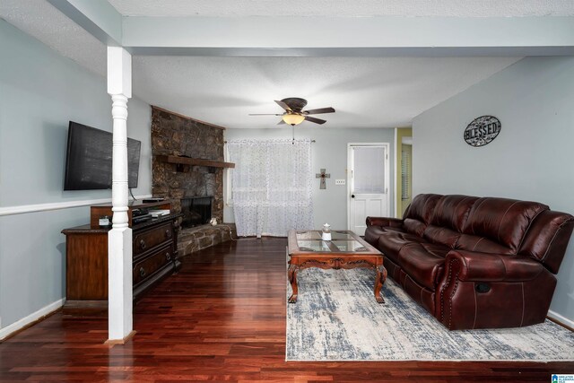 500 2nd Ter, Pleasant Grove, AL 35127 - living area with wood finished floors, a ceiling fan, baseboards, and a fireplace