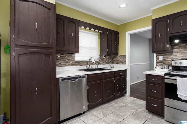 500 2nd Ter, Pleasant Grove, AL 35127 - kitchen with stainless steel appliances, a sink, light countertops, ornamental molding, and tasteful backsplash