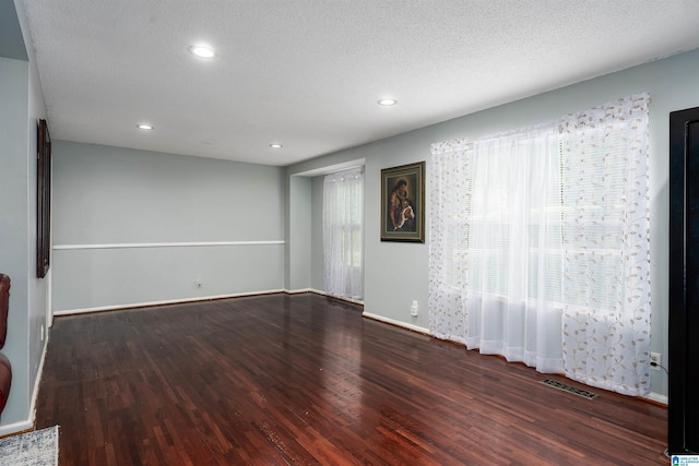 500 2nd Ter, Pleasant Grove, AL 35127 - empty room with wood finished floors, recessed lighting, a textured ceiling, and baseboards