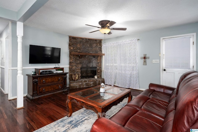 500 2nd Ter, Pleasant Grove, AL 35127 - living area with wood finished floors, ceiling fan, a textured ceiling, and a stone fireplace