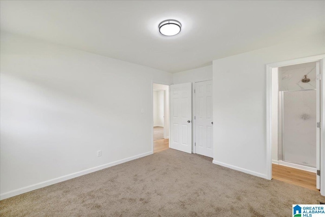 unfurnished bedroom featuring carpet floors and baseboards