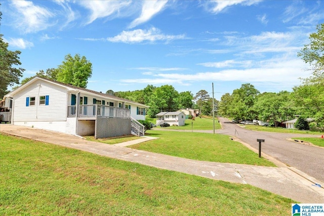 view of front facade with crawl space, a front yard, stairway, and a porch