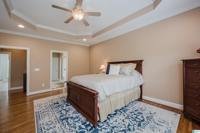 254 Macdonald Lake Rd, Springville, AL 35146 - bedroom featuring a raised ceiling, wood finished floors, crown molding, recessed lighting, and baseboards