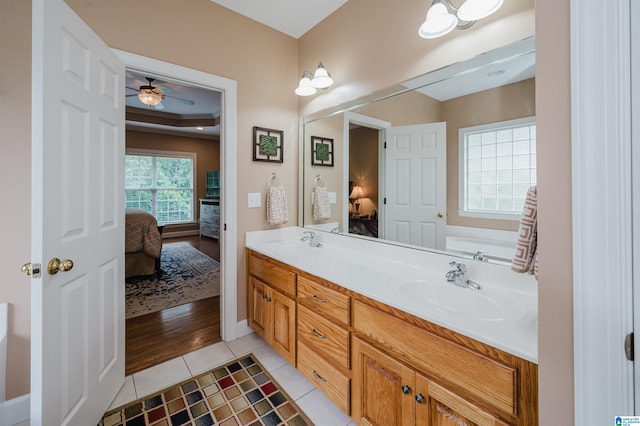 254 Macdonald Lake Rd, Springville, AL 35146 - ensuite bathroom with double vanity, a ceiling fan, tile patterned flooring, and baseboards