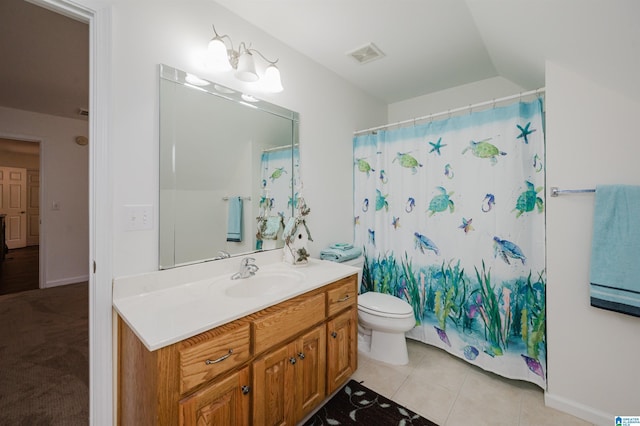 254 Macdonald Lake Rd, Springville, AL 35146 - bathroom featuring vanity, toilet, lofted ceiling, a shower with shower curtain, and tile patterned flooring
