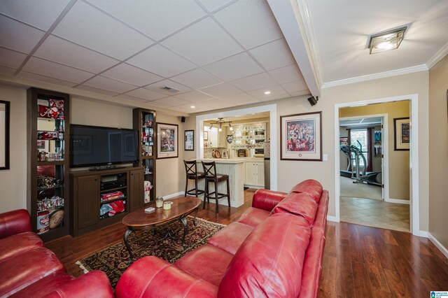 254 Macdonald Lake Rd, Springville, AL 35146 - living area with wood finished floors, baseboards, a paneled ceiling, ornamental molding, and recessed lighting