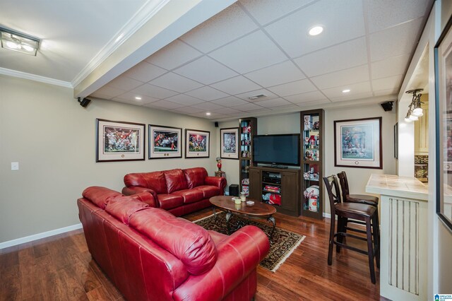 254 Macdonald Lake Rd, Springville, AL 35146 - living room featuring baseboards, dark wood-style floors, a drop ceiling, crown molding, and recessed lighting
