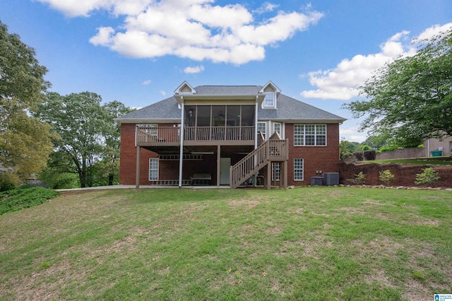 254 Macdonald Lake Rd, Springville, AL 35146 - rear view of house with a sunroom, brick siding, stairs, a yard, and central AC unit